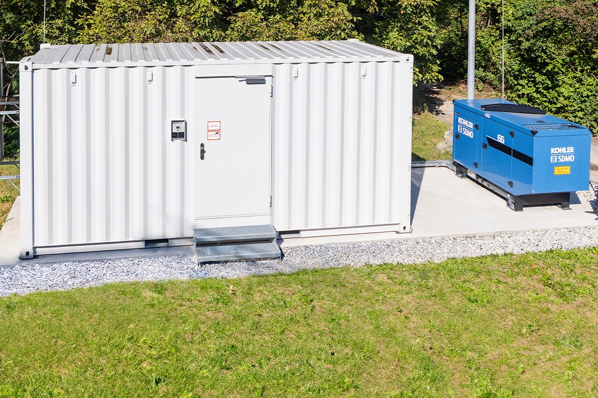 Here you can see a data center container with emergency power generator on the company premises of PKE with emergency power generator