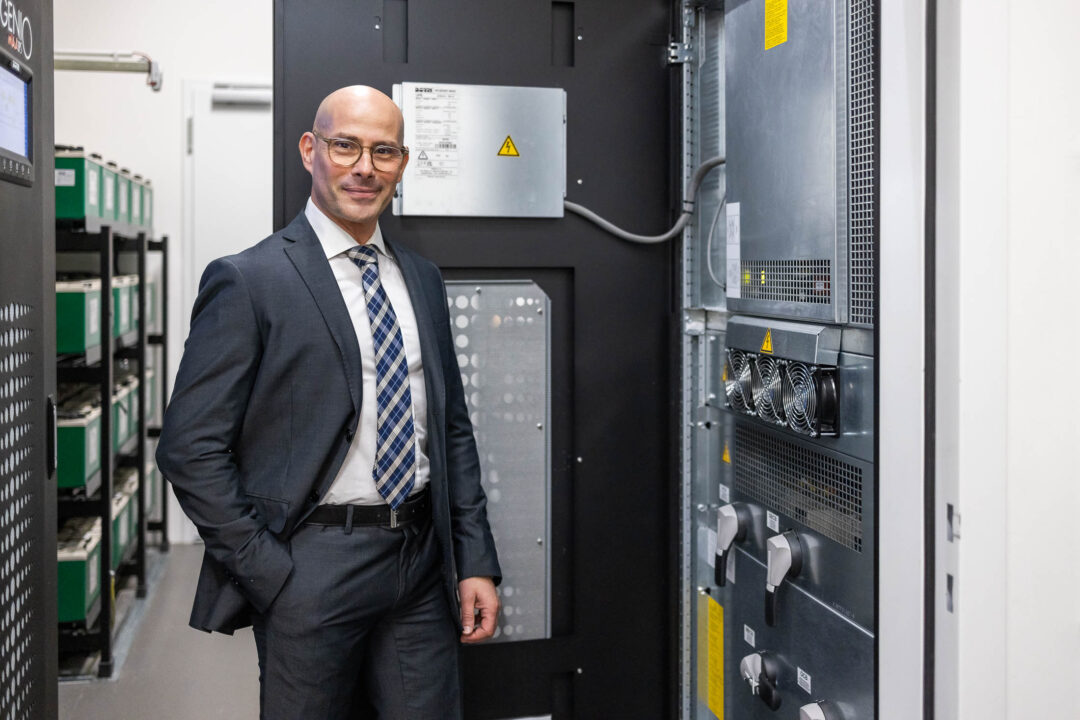 Luca Cappello stands in front of the Borri Ingenio MAX UPS system