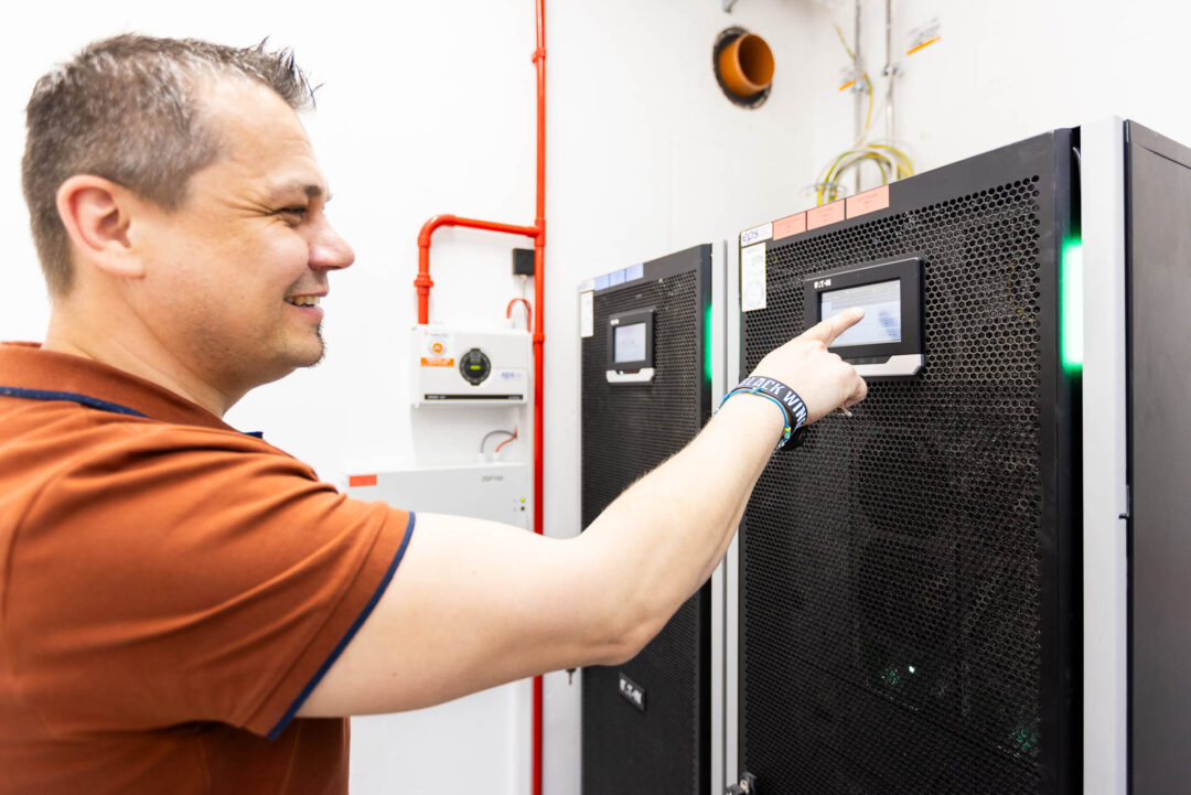 Paul Muehlbachler, IT Services Infrastructure Server, checks the UPS systems.