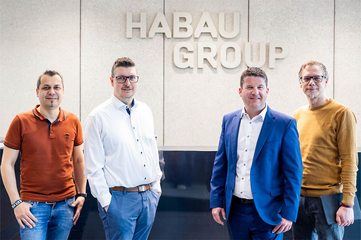 Paul Muehlbächler, IT Services at HABAU GROUP, Gerald Froschauer, IT Manager at HABAU GROUP, Peter Reisinger, Managing Director of EPS Electric Power Systems GmbH, Claus Hofer, Deputy Head of IT at HABAU GROUP, in a group photo.